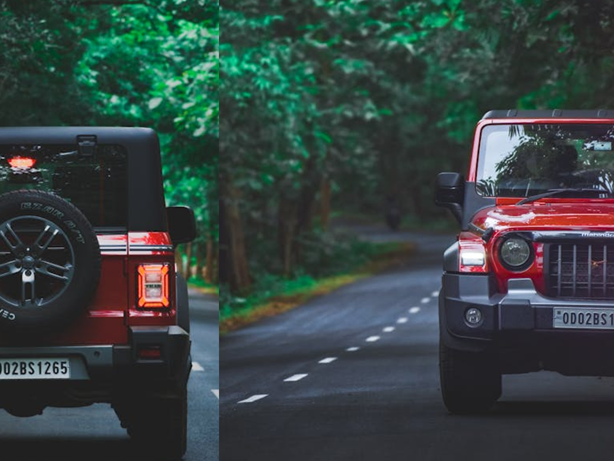 Side-by-side view of Mahindra Scorpio and Mahindra Thar, highlighting their rugged exteriors and distinct SUV designs.
