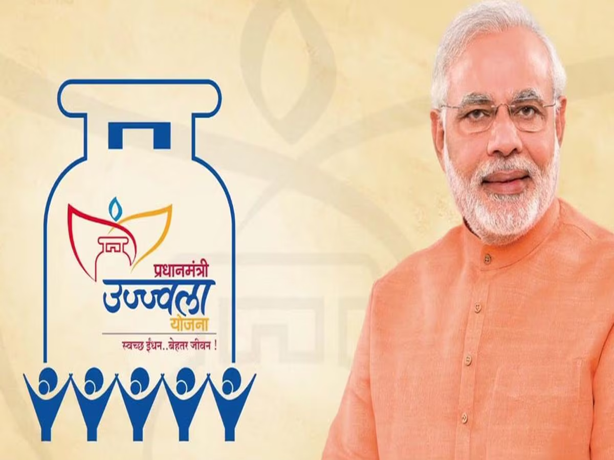 A woman using an LPG cylinder for cooking in a rural Indian kitchen, showcasing the benefits of PM Ujjwala Yojana.