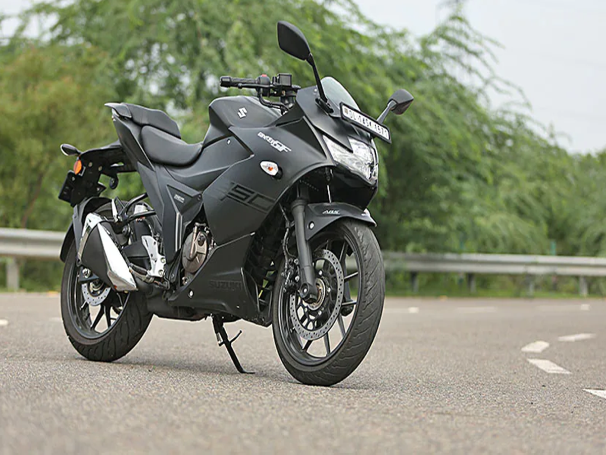Suzuki Gixxer SF 250 on a scenic highway, showcasing its sporty design and LED lights.